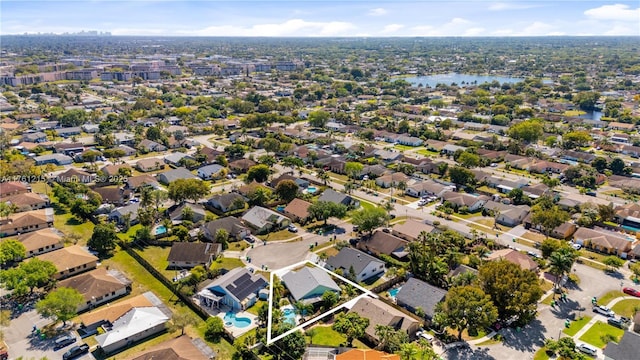 bird's eye view with a water view and a residential view