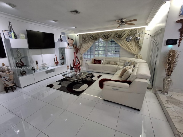 living area with visible vents, a ceiling fan, and ornamental molding