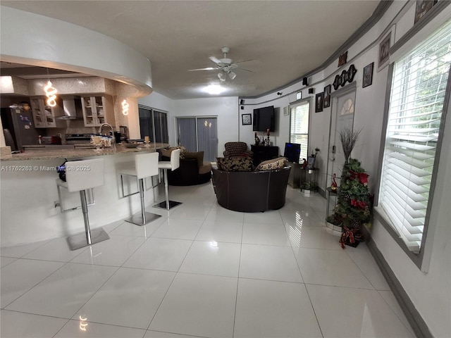 4511 Queen Palm Ln, Tamarac, FL 33319 - living room featuring ceiling fan, plenty of natural light, and light tile patterned floors