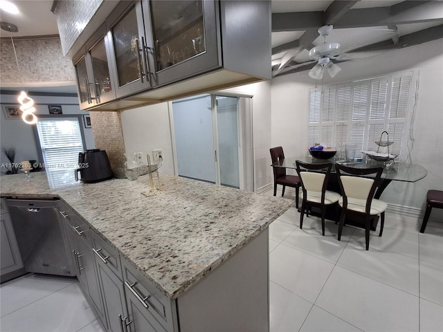 4511 Queen Palm Ln, Tamarac, FL 33319 - kitchen with gray cabinets, a ceiling fan, light stone counters, a peninsula, and glass insert cabinets