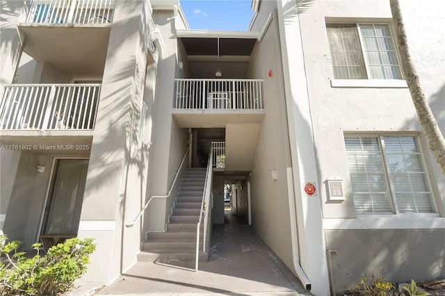 view of property featuring stairway