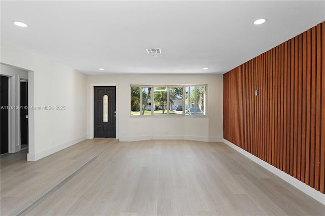 interior space featuring light wood finished floors, visible vents, recessed lighting, and baseboards