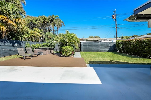 surrounding community featuring a patio area, a jacuzzi, a yard, and fence