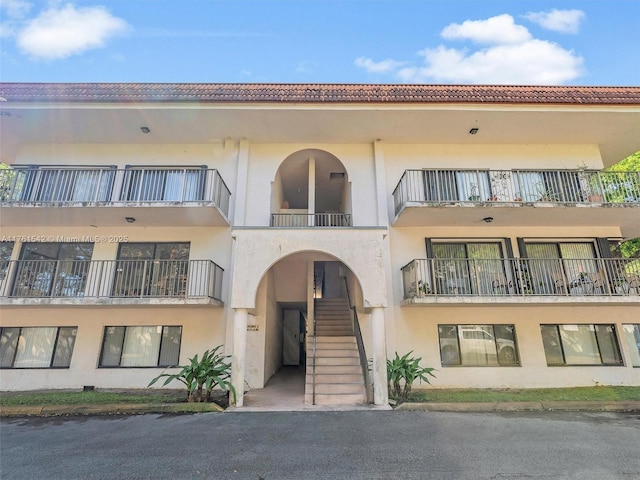 view of property featuring stairway