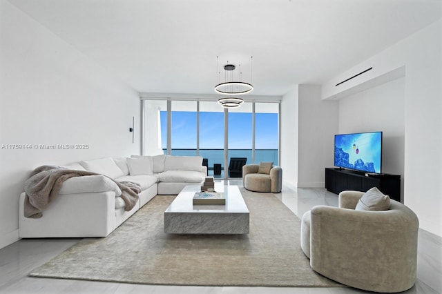 living room with floor to ceiling windows and baseboards