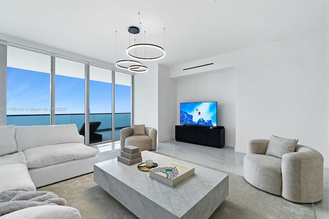 living room featuring marble finish floor and floor to ceiling windows