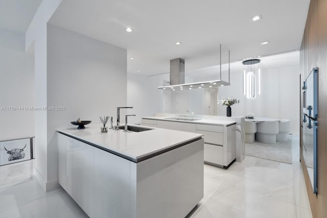 kitchen with range hood, stovetop, a sink, white cabinets, and modern cabinets