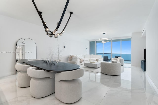 dining space with marble finish floor and expansive windows