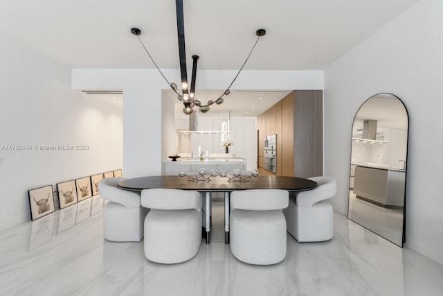 dining space featuring marble finish floor