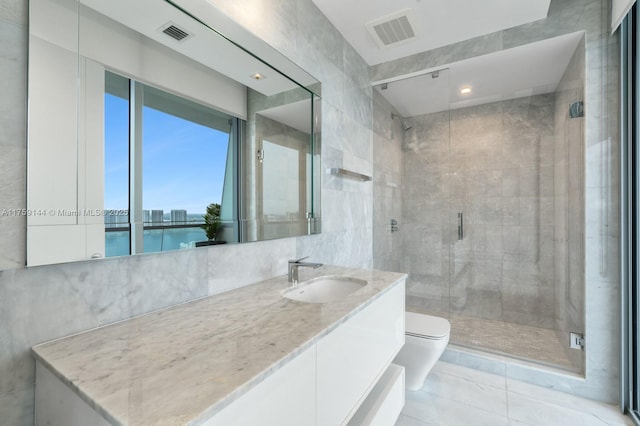 full bathroom with visible vents, a shower stall, toilet, and vanity