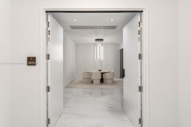 corridor with visible vents and marble finish floor