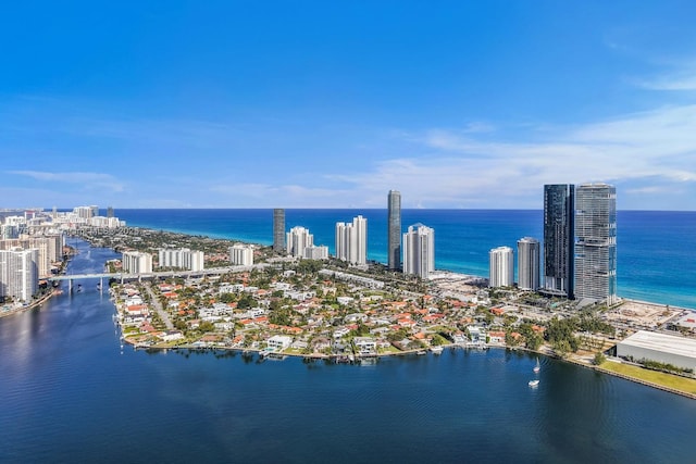 aerial view featuring a view of city and a water view