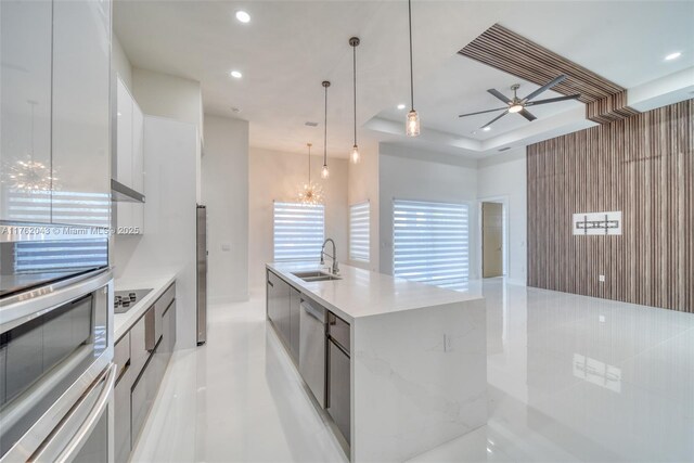 601SW 13th St, Cape Coral, FL 33991 - kitchen featuring modern cabinets, a sink, white cabinetry, recessed lighting, and light countertops