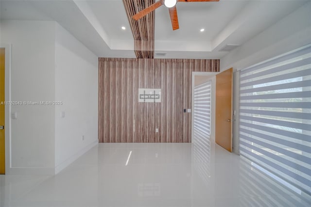 601SW 13th St, Cape Coral, FL 33991 - tiled empty room with a raised ceiling, ceiling fan, and recessed lighting