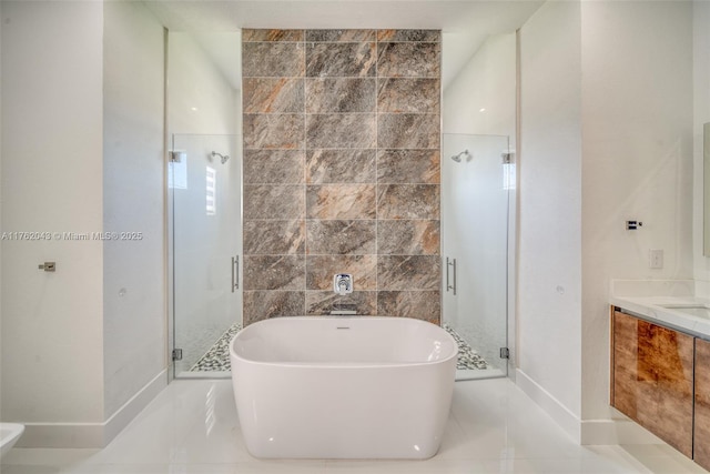 601SW 13th St, Cape Coral, FL 33991 - bathroom with a stall shower, a soaking tub, vanity, and baseboards