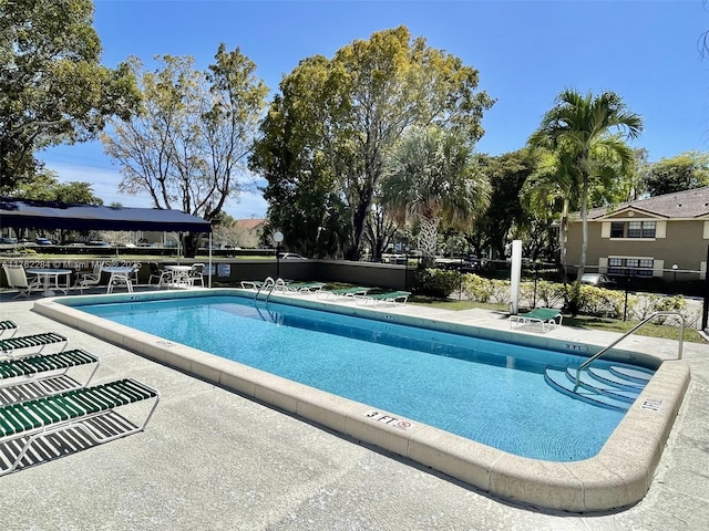 community pool featuring a patio area