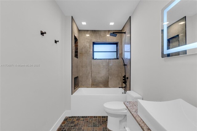 full bathroom featuring vanity, toilet, bathing tub / shower combination, and baseboards