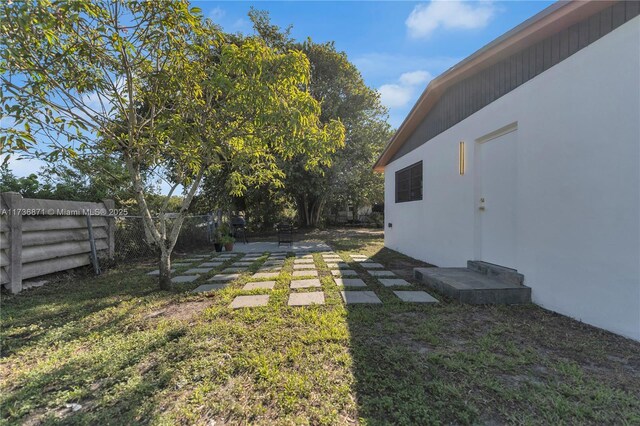 view of yard with a patio area and a fenced backyard