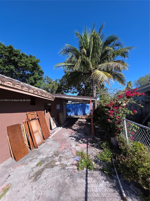 exterior space with a carport