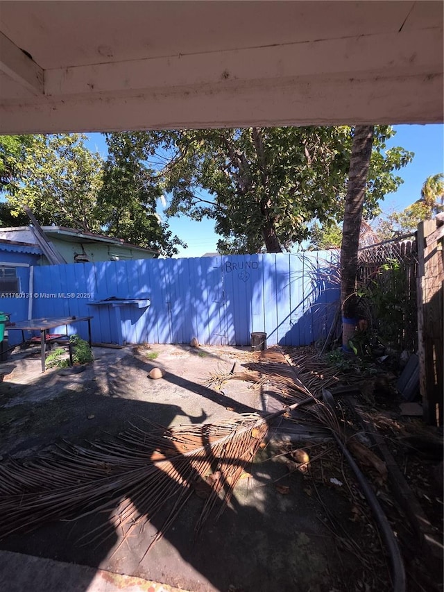 view of patio featuring fence