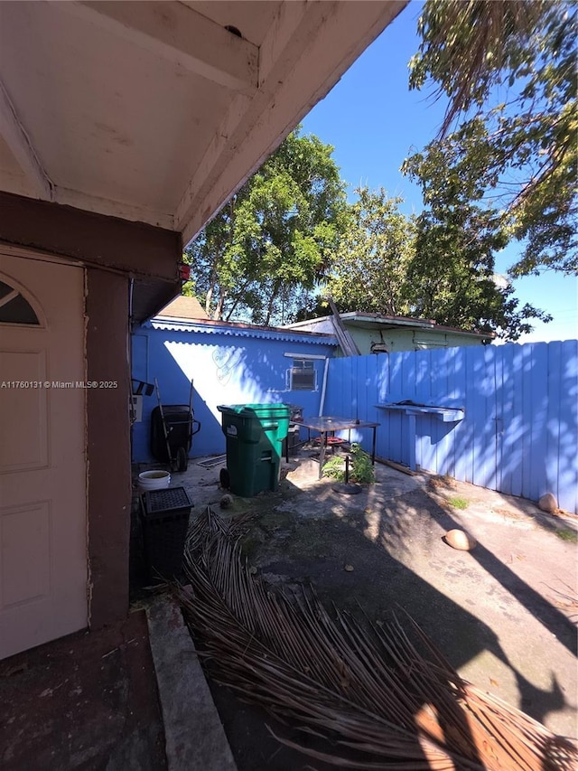 view of patio / terrace featuring fence