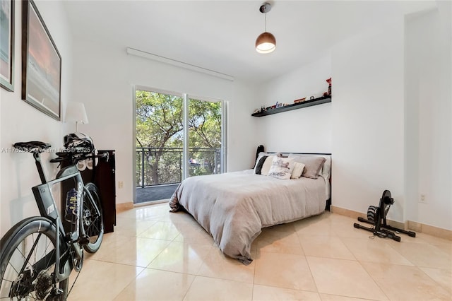 bedroom featuring tile patterned floors and baseboards