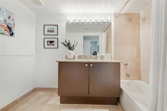 bathroom with tile patterned floors, visible vents, shower / bath combo with shower curtain, baseboards, and vanity