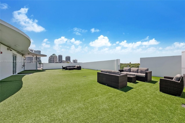 view of yard featuring a city view and an outdoor hangout area