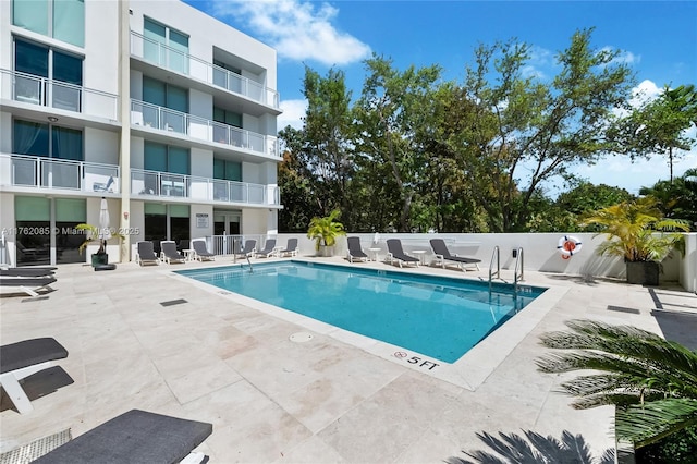 pool featuring a patio area