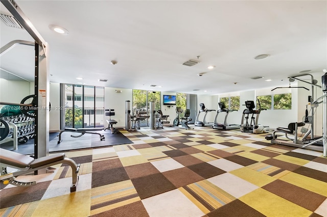 exercise room featuring recessed lighting, visible vents, and carpet floors