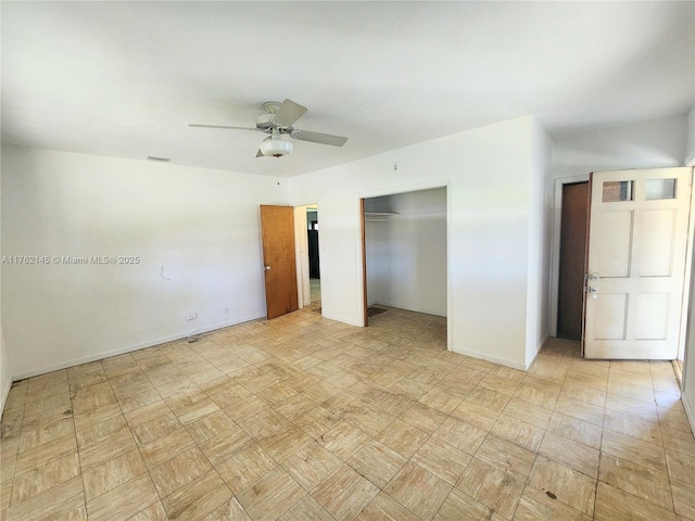 unfurnished bedroom with baseboards, visible vents, a closet, and ceiling fan