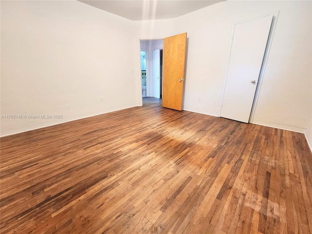 unfurnished bedroom with wood-type flooring