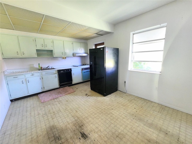 kitchen featuring light floors, black appliances, light countertops, and open shelves