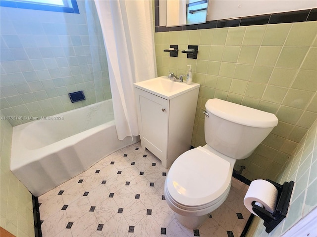 bathroom with toilet, tile walls, and a healthy amount of sunlight