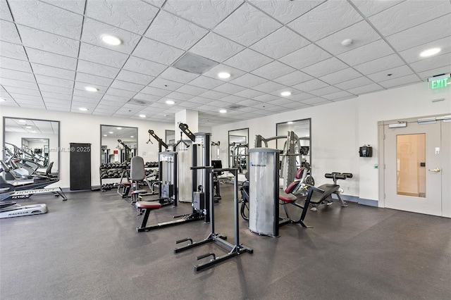 workout area with recessed lighting, a paneled ceiling, and baseboards