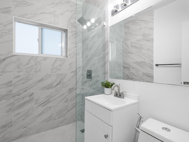 bathroom with vanity, toilet, and a walk in shower