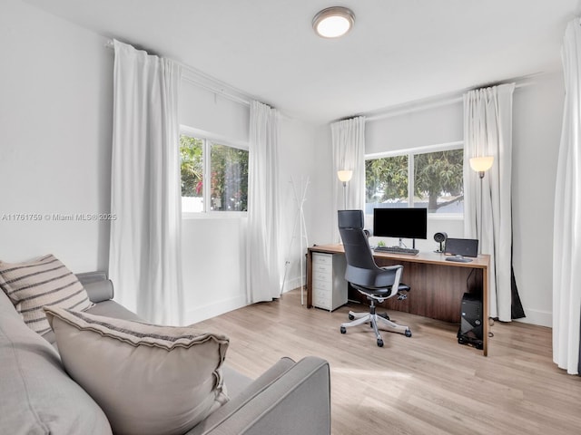 office with wood finished floors and baseboards