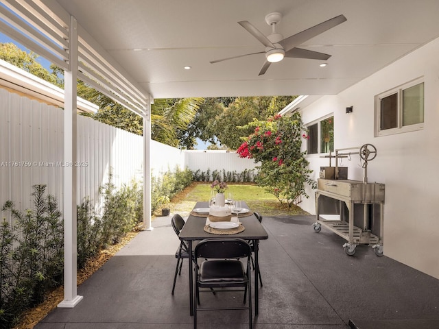 view of patio / terrace featuring a fenced backyard and a ceiling fan