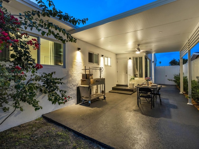 view of patio / terrace featuring a ceiling fan and fence