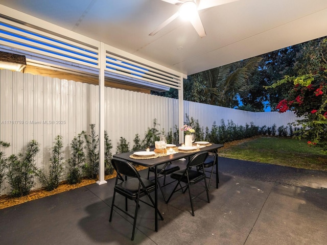 view of patio featuring outdoor dining area and a fenced backyard