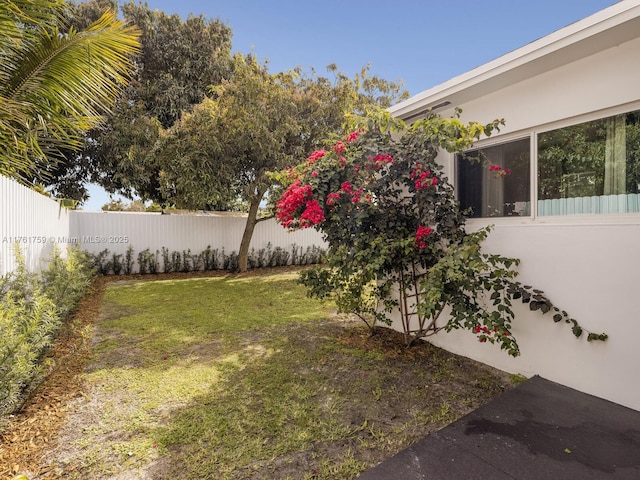 view of yard with a fenced backyard