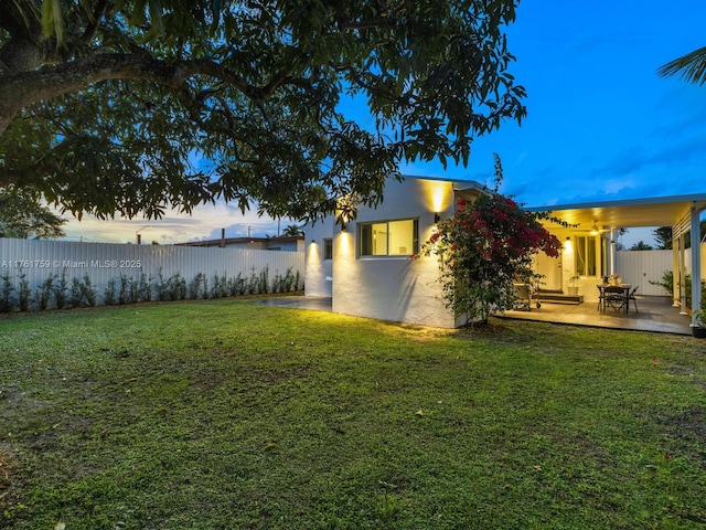 view of yard with a patio area and a fenced backyard