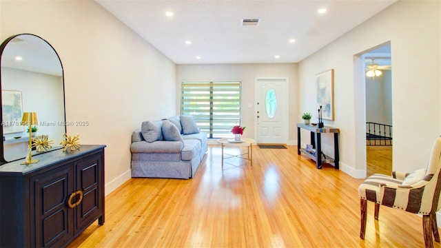 living room with visible vents, recessed lighting, baseboards, and light wood-style floors