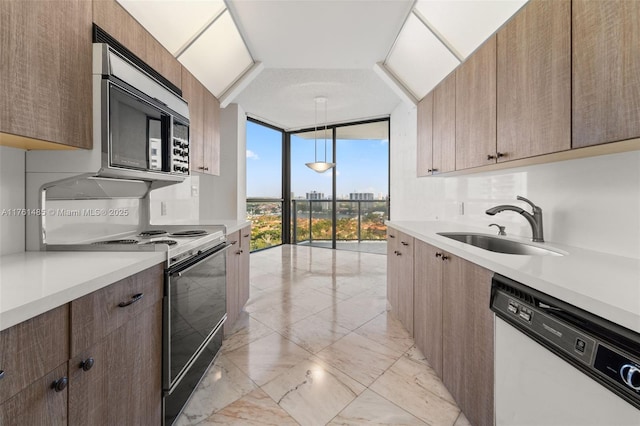 kitchen with a sink, light countertops, floor to ceiling windows, dishwasher, and marble finish floor