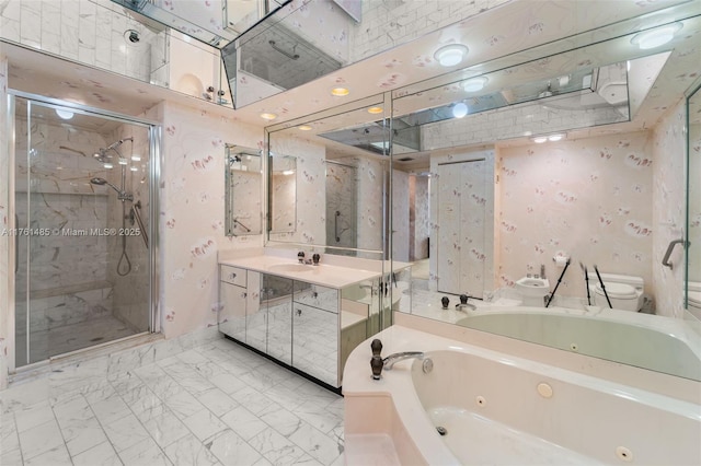 bathroom featuring vanity, toilet, a stall shower, and marble finish floor