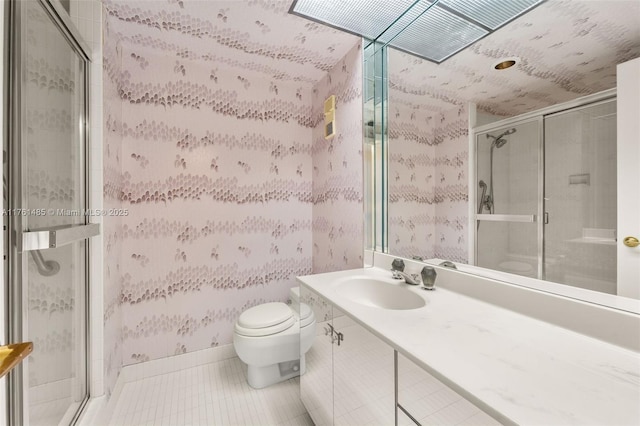 full bath featuring tile patterned flooring, a shower stall, wallpapered walls, toilet, and vanity