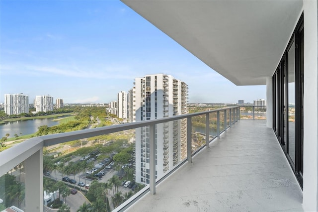 balcony featuring a view of city and a water view