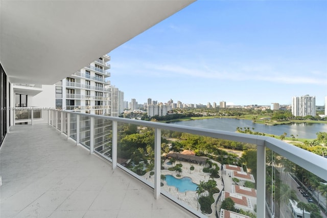 balcony featuring a view of city and a water view