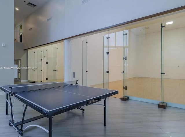 playroom featuring a high ceiling and visible vents