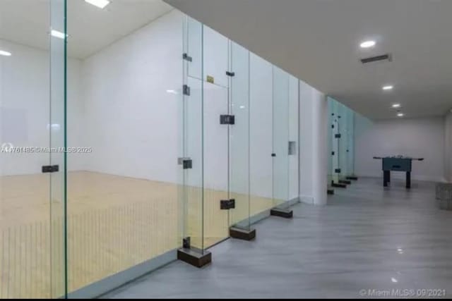 hallway with visible vents and recessed lighting